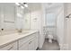 Bright bathroom featuring a granite countertop vanity, tiled floors, and a shower/tub combo at 2760 Berkhamstead Cir, Concord, NC 28027
