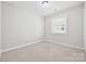 A bright, carpeted bedroom with a window at 2760 Berkhamstead Cir, Concord, NC 28027