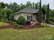 Charming single-story home featuring manicured landscaping and craftsman-style architectural details at 2760 Berkhamstead Cir, Concord, NC 28027
