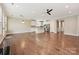 Bright, open-concept living space with hardwood floors, and direct access to the kitchen at 2760 Berkhamstead Cir, Concord, NC 28027