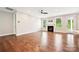 Bright and airy living room with fireplace, hardwood floors, and access to the outdoors at 2760 Berkhamstead Cir, Concord, NC 28027