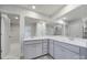Bathroom features double vanity and mirror, view to shower, and closet at 300 Kennerly Center Dr, Mooresville, NC 28115