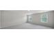 Bright bedroom with neutral walls, carpeted flooring, and large windows at 300 Kennerly Center Dr, Mooresville, NC 28115