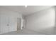 Bedroom includes carpeted floor, closet, and door to another room at 300 Kennerly Center Dr, Mooresville, NC 28115