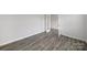 Bright bedroom features stylish gray wood-look flooring and an open doorway at 300 Kennerly Center Dr, Mooresville, NC 28115