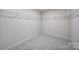 Walk-in closet with shelving and neutral walls at 300 Kennerly Center Dr, Mooresville, NC 28115