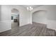 Elegant dining room with wood-style floors, wainscoting, and chandelier at 300 Kennerly Center Dr, Mooresville, NC 28115