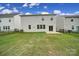 The back of the house features a simple patio with a fenced-in yard that gives privacy at 300 Kennerly Center Dr, Mooresville, NC 28115