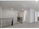 Hallway showcasing neutral paint, carpet and iron railing at 300 Kennerly Center Dr, Mooresville, NC 28115