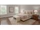 Serene primary bedroom showcasing a neutral color palette, hardwood floors, and ample natural light at 3009 Ocaso Ct, Matthews, NC 28104