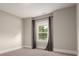 This bedroom features neutral paint, carpet, white trim and baseboards and has a window with decorative curtains at 3009 Ocaso Ct, Matthews, NC 28104