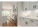 Bright kitchen featuring white cabinetry, stainless steel appliances, and a view to the dining room at 3009 Ocaso Ct, Matthews, NC 28104