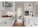 Bright, modern kitchen features white cabinetry, stainless steel appliances, and a tile backsplash at 3009 Ocaso Ct, Matthews, NC 28104