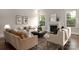 Well-appointed living room features comfortable seating, fireplace, natural light, and sophisticated decor at 3009 Ocaso Ct, Matthews, NC 28104