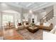 Spacious open-concept living area with seamless flow between kitchen, dining, and living spaces at 3009 Ocaso Ct, Matthews, NC 28104