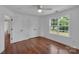 Inviting bedroom features hardwood floors, double closets, a window overlooking landscape, and two entry doors at 3068 River Rd, Shelby, NC 28152