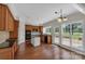 Well-appointed kitchen features wood cabinetry, black countertops, and stainless appliances at 3068 River Rd, Shelby, NC 28152