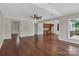 Expansive living room featuring hardwood floors, an open layout, and views into the kitchen at 3068 River Rd, Shelby, NC 28152