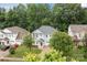 Traditional two-story home with a well-manicured lawn and mature trees, offering classic curb appeal and charm at 308 Planters Way, Mount Holly, NC 28120