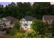 Stately two-story home with manicured lawn and mature trees, offering curb appeal and a welcoming entrance at 308 Planters Way, Mount Holly, NC 28120