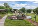 Playground with slides, climbing structures, and picnic areas surrounded by green grass at 308 Planters Way, Mount Holly, NC 28120