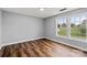 A spacious bedroom offering generous natural light and wood laminate flooring at 3124 Pikes Peak Dr, Gastonia, NC 28052