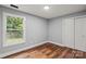 A cozy bedroom with a view outside the window and a double door closet at 3124 Pikes Peak Dr, Gastonia, NC 28052