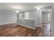 Bright bonus room with hard wood floors, great natural light, and a stylish chandelier at 3124 Pikes Peak Dr, Gastonia, NC 28052