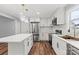 Updated kitchen featuring white cabinets, stainless steel appliances, and a center island at 3124 Pikes Peak Dr, Gastonia, NC 28052