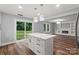 Modern kitchen with a large island, stainless steel appliances, and stylish pendant lighting at 3124 Pikes Peak Dr, Gastonia, NC 28052
