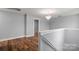 Upstairs landing area with hardwood floors, neutral paint and plenty of natural light at 3124 Pikes Peak Dr, Gastonia, NC 28052