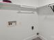 White laundry room features hookups and plenty of shelving at 3124 Pikes Peak Dr, Gastonia, NC 28052