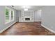 Spacious living area with hardwood floors, fireplace and natural light, creating a welcoming atmosphere at 3124 Pikes Peak Dr, Gastonia, NC 28052