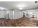 Bright, open-concept space showcasing hardwood floors and a modern kitchen with stainless steel appliances at 3124 Pikes Peak Dr, Gastonia, NC 28052