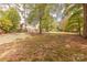Large backyard with mature trees and natural landscaping, providing a private and tranquil retreat at 3318 Providence Hills Dr, Matthews, NC 28105
