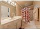Full bathroom with modern vanity, shower-tub combination and white tiled floors at 3318 Providence Hills Dr, Matthews, NC 28105