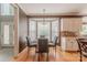 Bright breakfast nook features large windows, offering ample natural light and a cozy atmosphere for casual dining experiences at 3318 Providence Hills Dr, Matthews, NC 28105