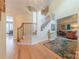 Spacious foyer featuring hardwood floors, staircase, and ample natural light at 3318 Providence Hills Dr, Matthews, NC 28105