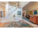Inviting foyer with staircase, hardwood floors, and view into the living room at 3318 Providence Hills Dr, Matthews, NC 28105
