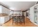 Bright, airy kitchen featuring white cabinets, stainless steel appliances, and a spacious center island with barstool seating at 3318 Providence Hills Dr, Matthews, NC 28105