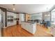 Gourmet kitchen with white cabinets, island, and modern appliances offering a seamless cooking experience with easy access to living spaces at 3318 Providence Hills Dr, Matthews, NC 28105