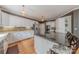 Chef's kitchen boasts granite countertops, stainless appliances, a breakfast bar, and custom cabinetry, perfect for culinary enthusiasts at 3318 Providence Hills Dr, Matthews, NC 28105