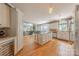Open-concept kitchen with a large island, wine cooler, and stainless steel appliances ideal for entertaining and Gathering gatherings at 3318 Providence Hills Dr, Matthews, NC 28105