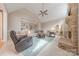 Bright living room featuring a stone fireplace, vaulted ceilings, and custom built-in shelving at 3318 Providence Hills Dr, Matthews, NC 28105