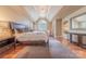 Spacious main bedroom features hardwood floors, tray ceilings, and a large window at 3318 Providence Hills Dr, Matthews, NC 28105