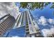 Modern high-rise building showcasing contemporary architecture with blue glass and a view of the sky at 333 W Trade St # 1304, Charlotte, NC 28202