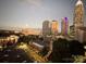 Evening city skyline view with skyscrapers and historic architecture at 333 W Trade St # 1304, Charlotte, NC 28202