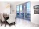 Dining area featuring large windows with city views, a modern chandelier, and elegant furniture at 333 W Trade St # 1304, Charlotte, NC 28202