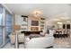 Spacious living area featuring modern décor, fireplace, and a kitchen with center island at 333 W Trade St # 1304, Charlotte, NC 28202
