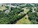 Aerial view of a charming community nestled among lush trees, featuring homes and a prominent water tower at 3423 S Hwy 127 Hwy, Hickory, NC 28602